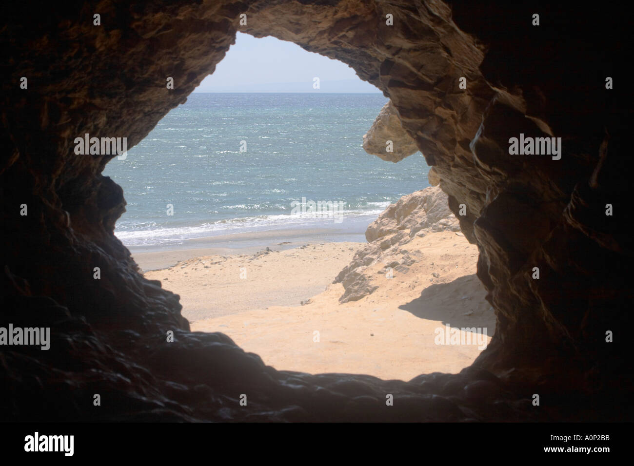 A cave overlooking the beach at Hamam Faraon Pharaoh s Hot Springs Western Sinai Egypt Stock Photo