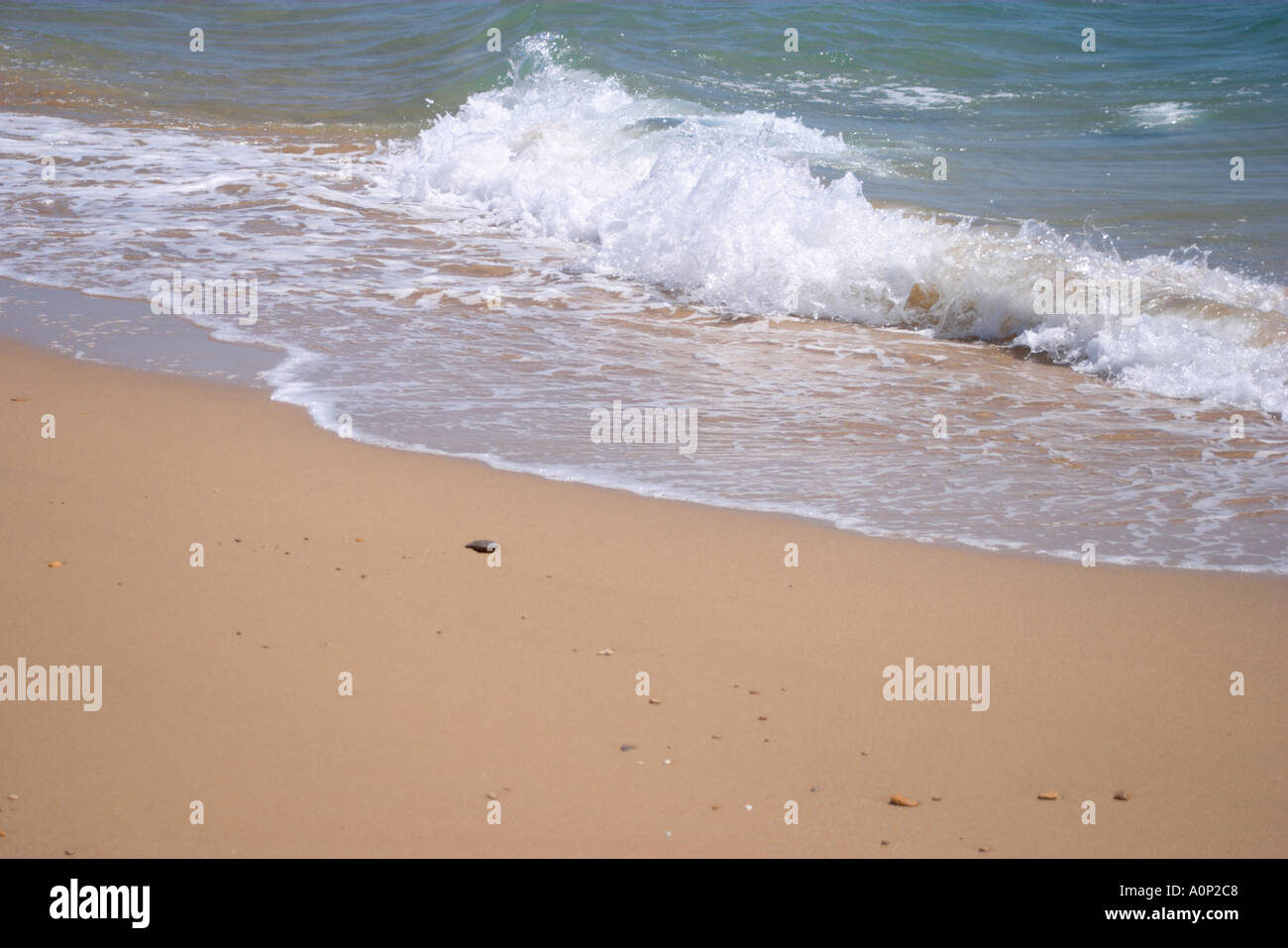 Waves breaking on the beach Stock Photo - Alamy