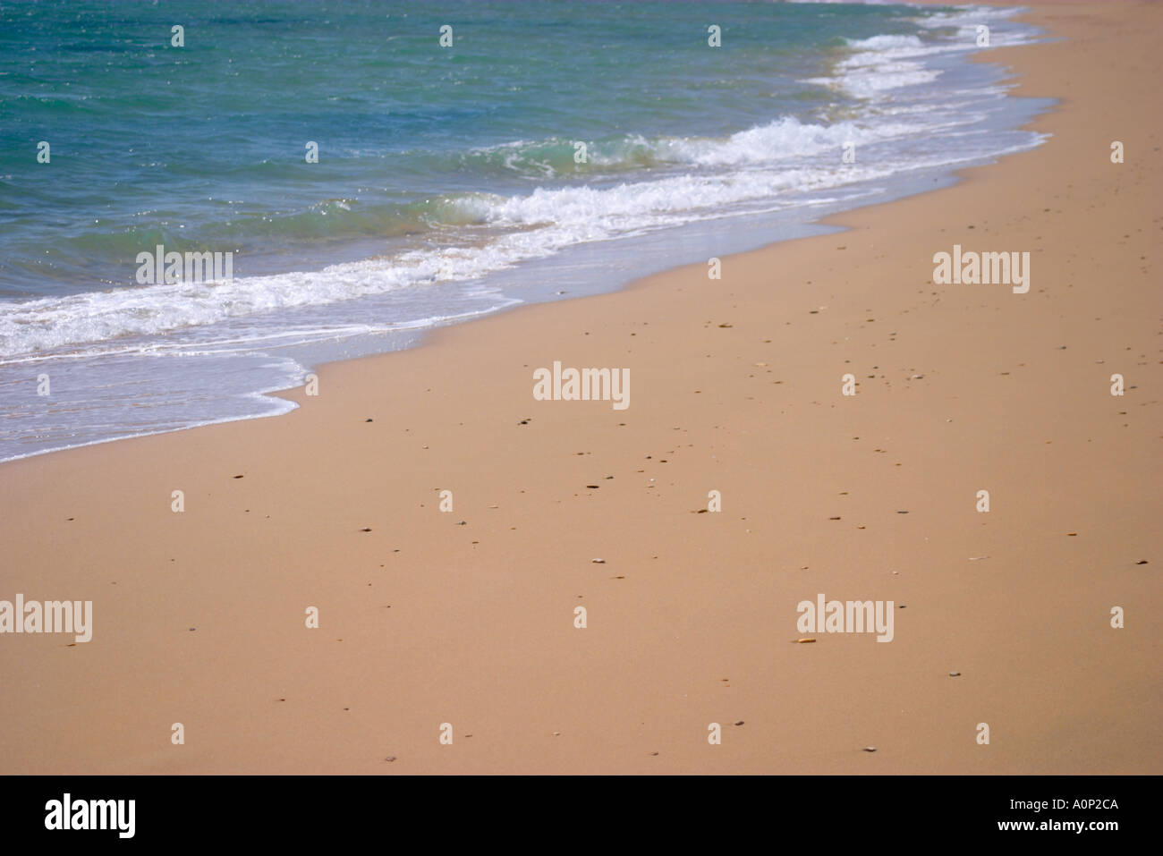 Waves breaking on the beach Stock Photo - Alamy