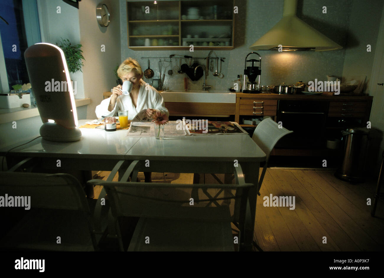 The Use Of Bright Light Lamps In The Kitchen At Breakfast To Stop A Stock Photo Alamy