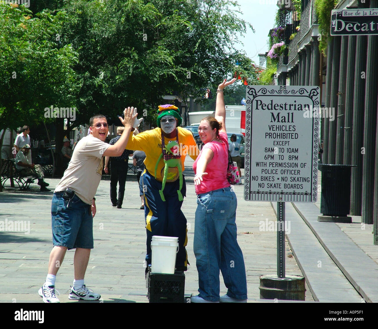 New Orleans Louisiana street scene entertainer with tourists Stock