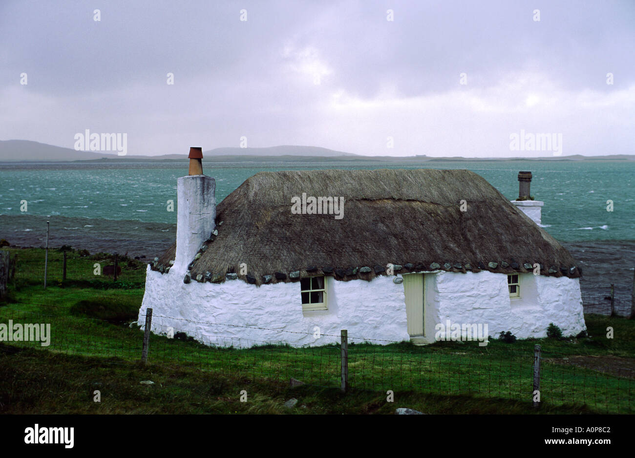 Outer Hebrides island of North Uist, Scotland, UK. Traditional croft house thatched cottage at Malacleit Stock Photo