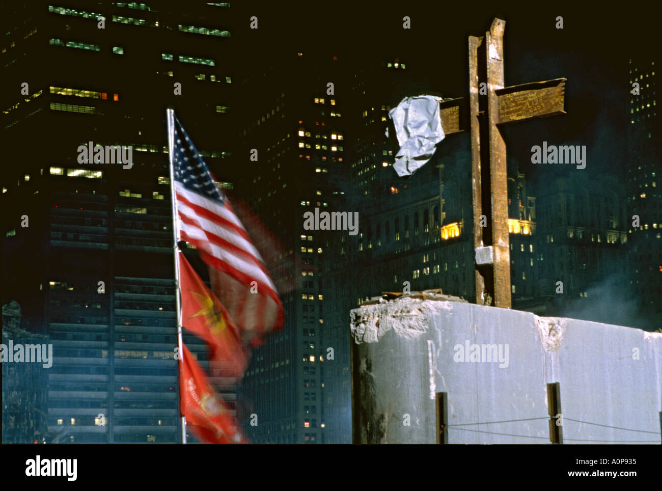 Among the debris of the World Trade Center attack in New York City after the September 11, 2001 terrorist attack a cross was raised by ironworkers. Stock Photo