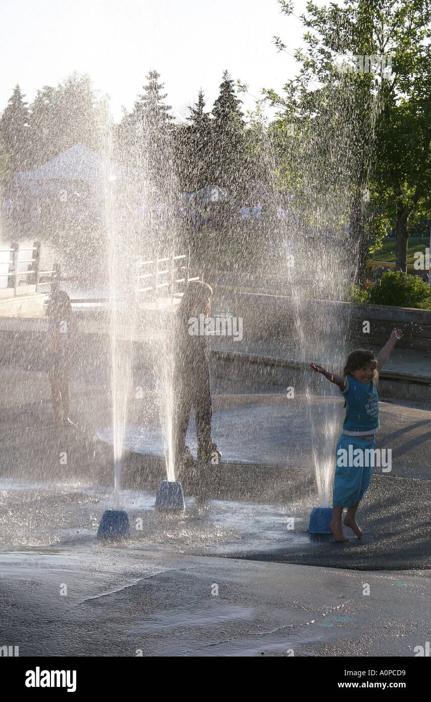Young girl playing in fountain Lloydminster Alberta Canada Stock Photo ...