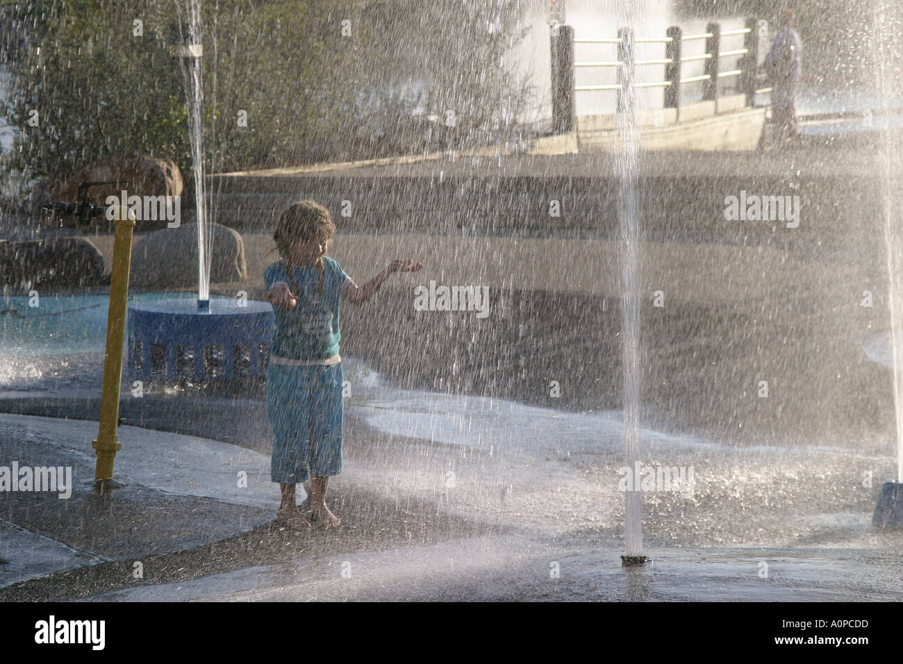 Young girl playing in fountain Lloydminster Alberta Canada Stock Photo ...