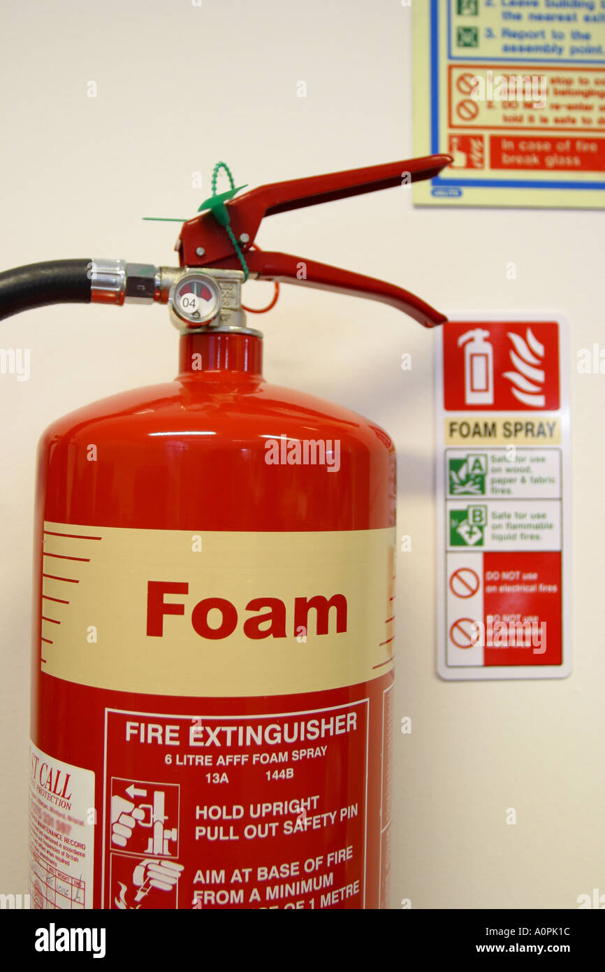 Foam filled red fire extinguisher Stock Photo Alamy