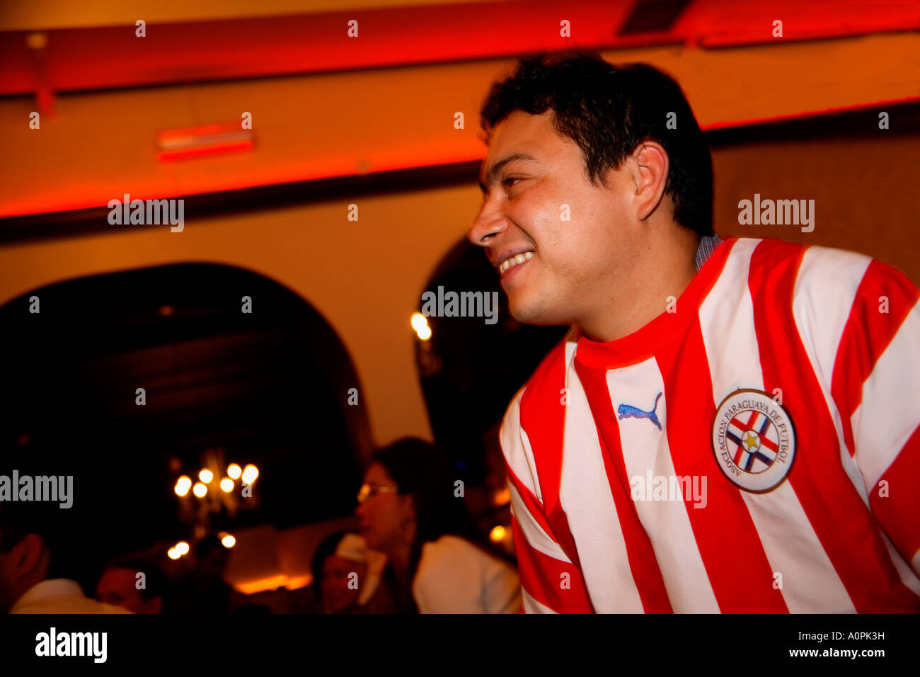 Paraguayan fan watching 1-0 defeat by Sweden, 2006 World Cup Finals, Nueva Costa Dorada Bar, London Stock Photo