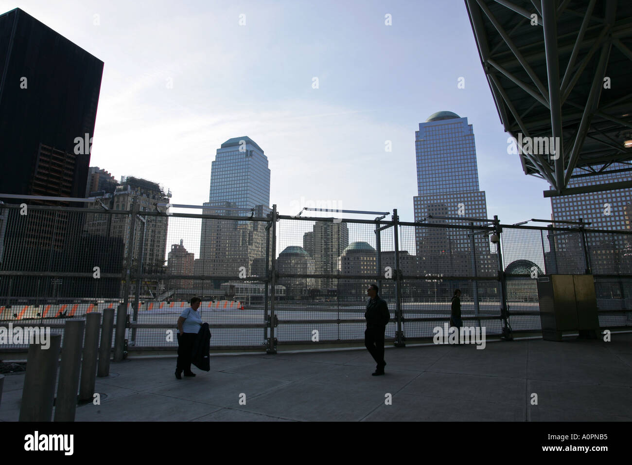 Tourists visit the Ground Zero site of the former World Trade Center ...