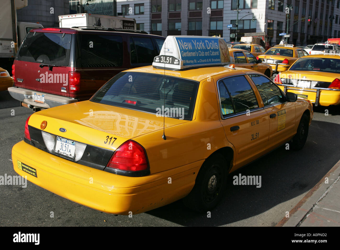 A typical New York City licensed yellow taxi cab car waits for a Stock Photo 3280337 Alamy