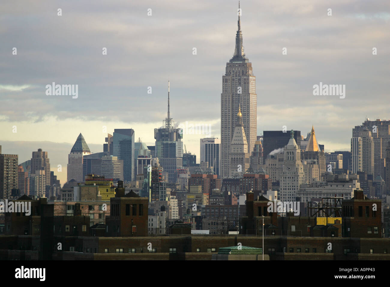 Famous landmark the Empire State Building and New York City skyline viewed from the Brooklyn Bridge New York City USA America Stock Photo