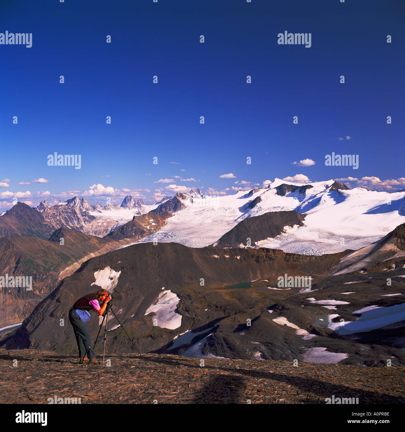 Photographer taking a Picture of Peaks and Glaciers in Purcell Mountains, Bugaboo Provincial Park, BC, British Columbia, Canada Stock Photo