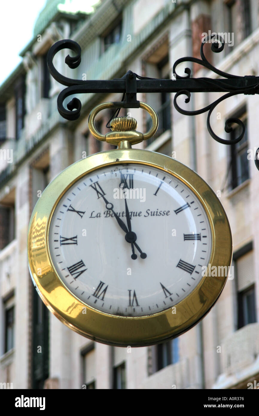 Clock in the shape of a pocketwatch on a shop in Budapest Hungary Stock