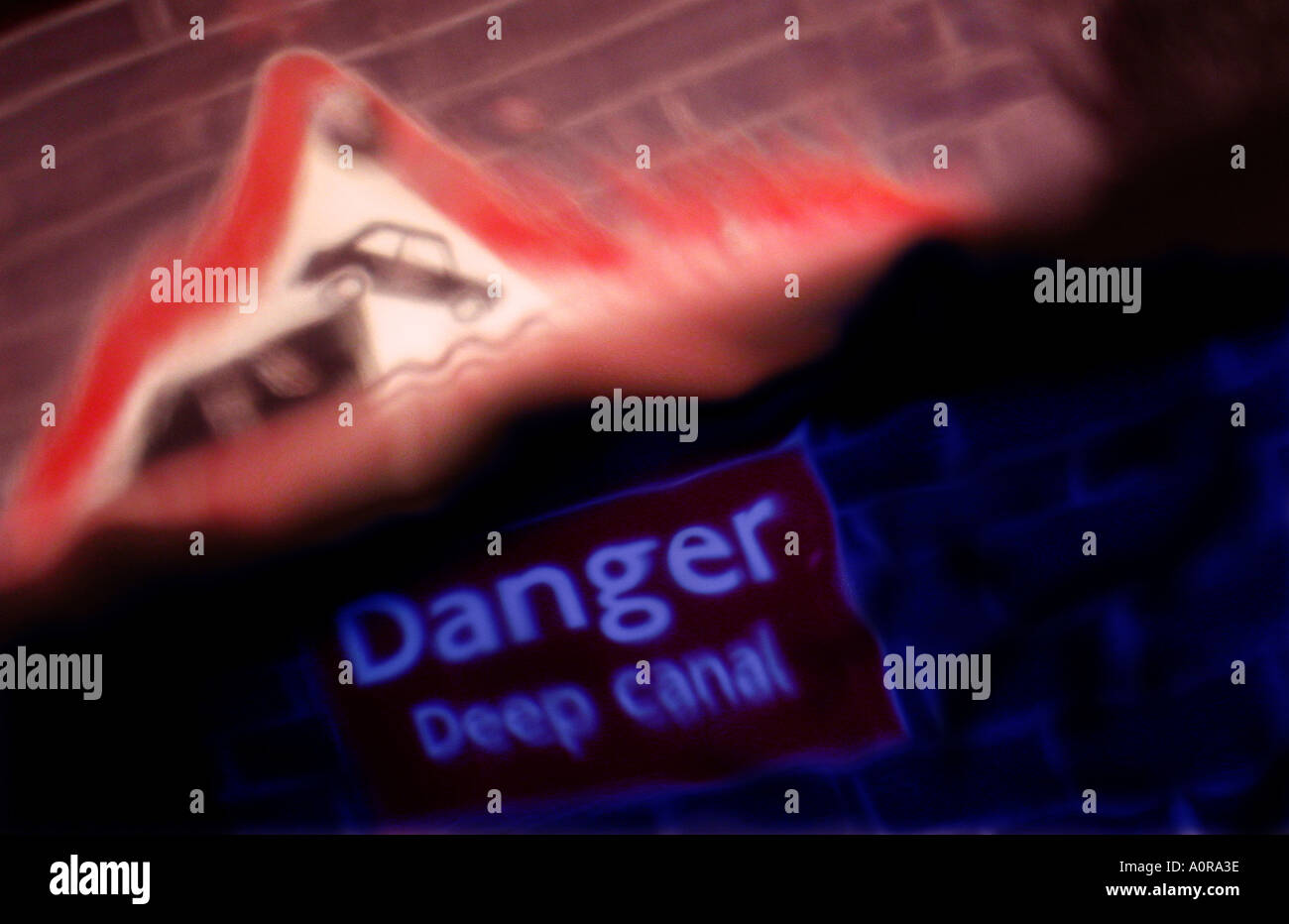 A 'Too Late' view of a Danger Deep Canal sign from below water surface Stock Photo