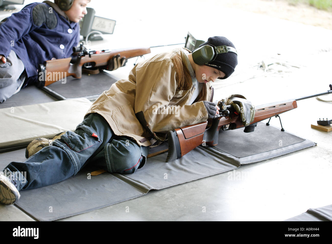 Boys and guns at Bisley rifle shooting range England Stock Photo Alamy