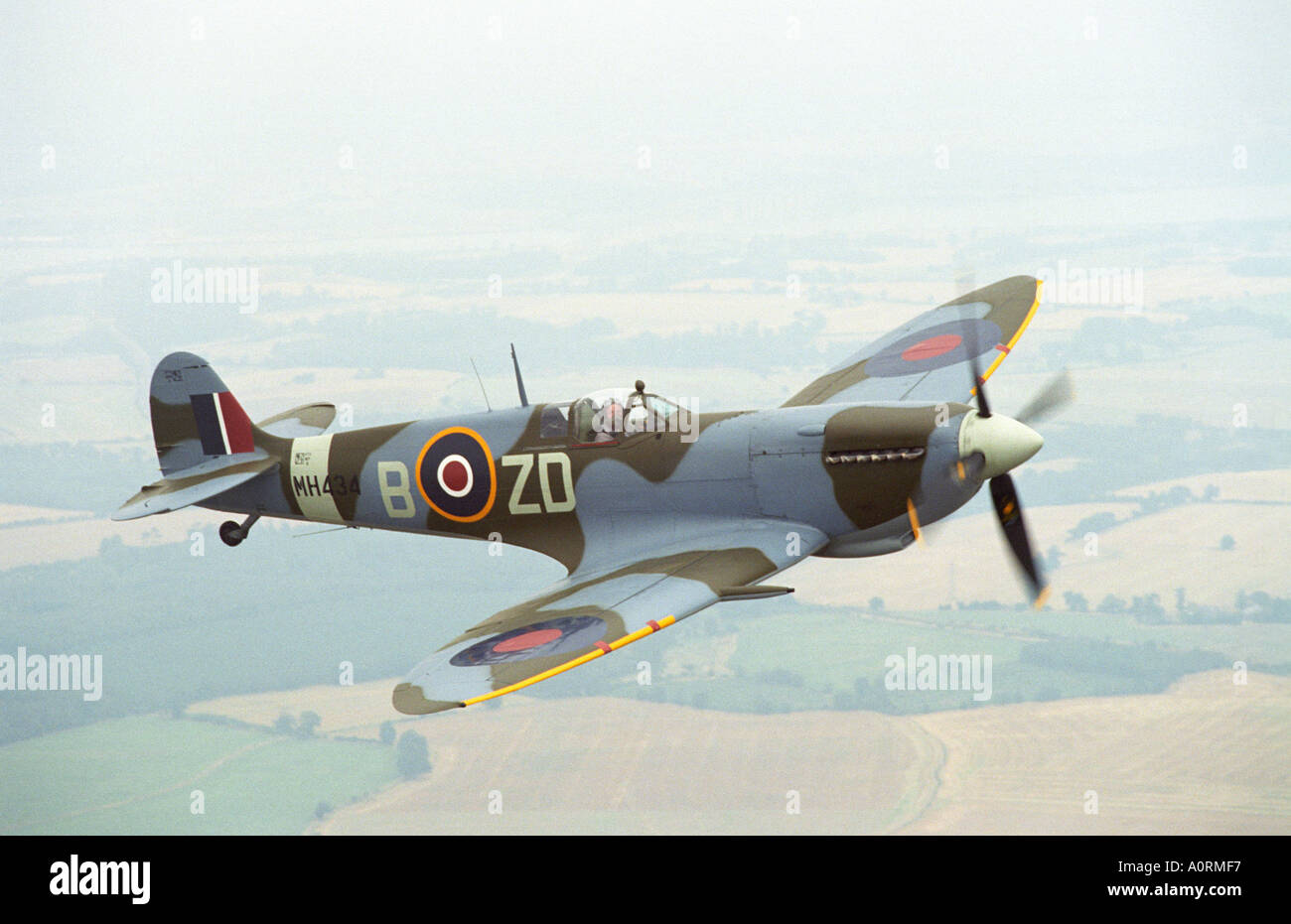 Spitfire Mk IXB in flight piloted by Ray Hanna Stock Photo
