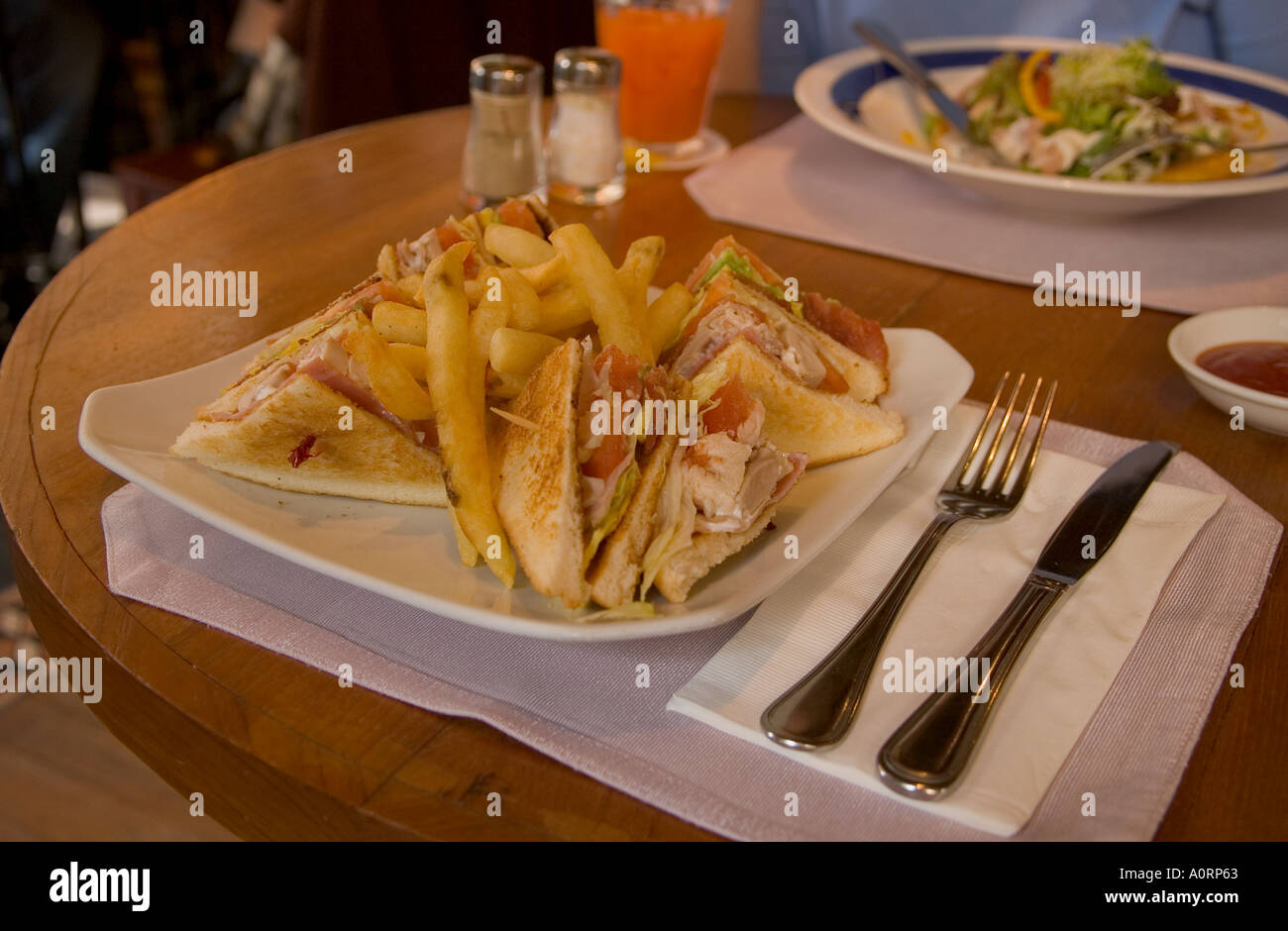 dh The Peak Lookout restaurant VICTORIA PEAK HONG KONG Club sandwich stack and chips sandwiches plate dinner table with food cafe Stock Photo