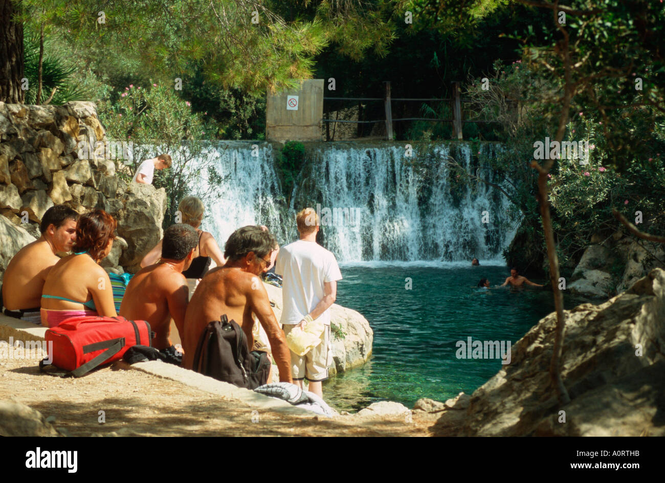 Vacationists at waterfall / Fuentes del Algar / Urlauber an Wasserfall Stock Photo