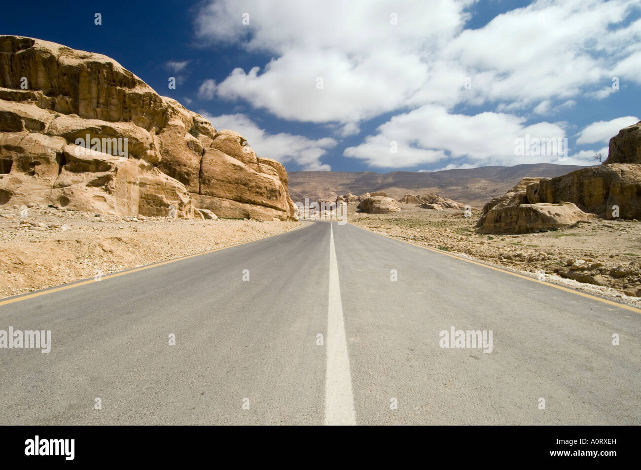 Road through rocky landscape Jordan Middle East Stock Photo