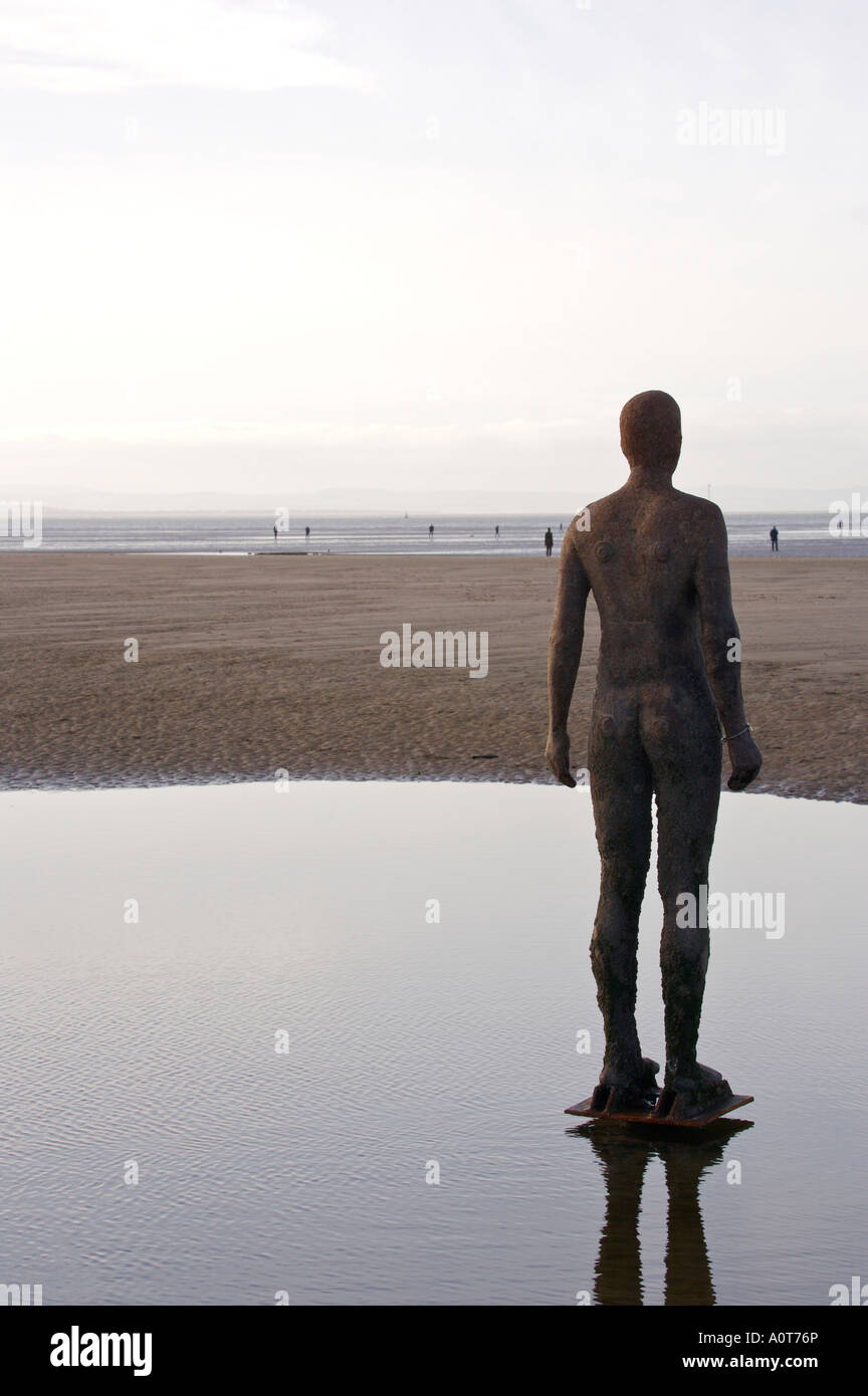 Anthony Gormley's bronze sculptures Crosby beach near Liverpool England