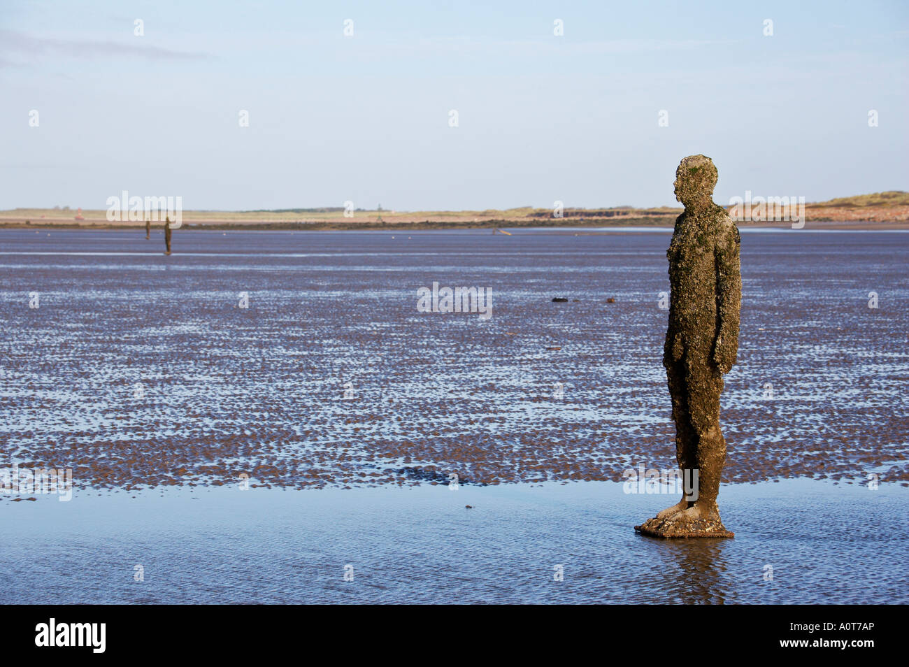 Anthony Gormley's bronze sculptures Crosby beach near Liverpool England