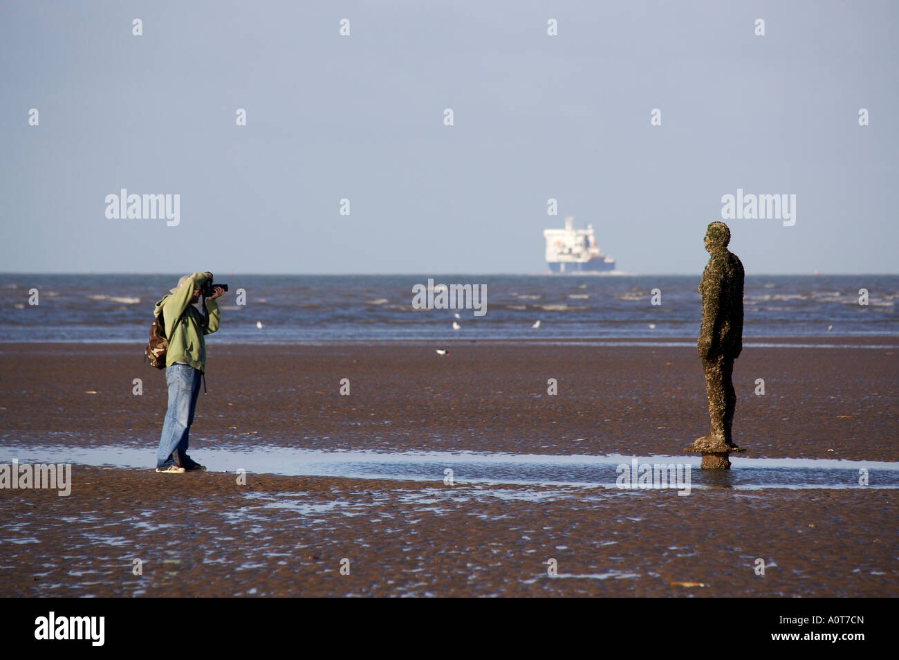 Anthony Gormley's bronze sculptures Crosby beach near Liverpool England