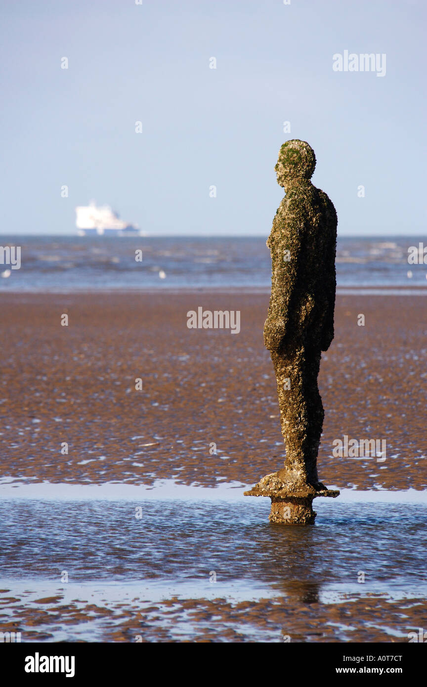 Anthony Gormley's bronze sculptures Crosby beach near Liverpool England