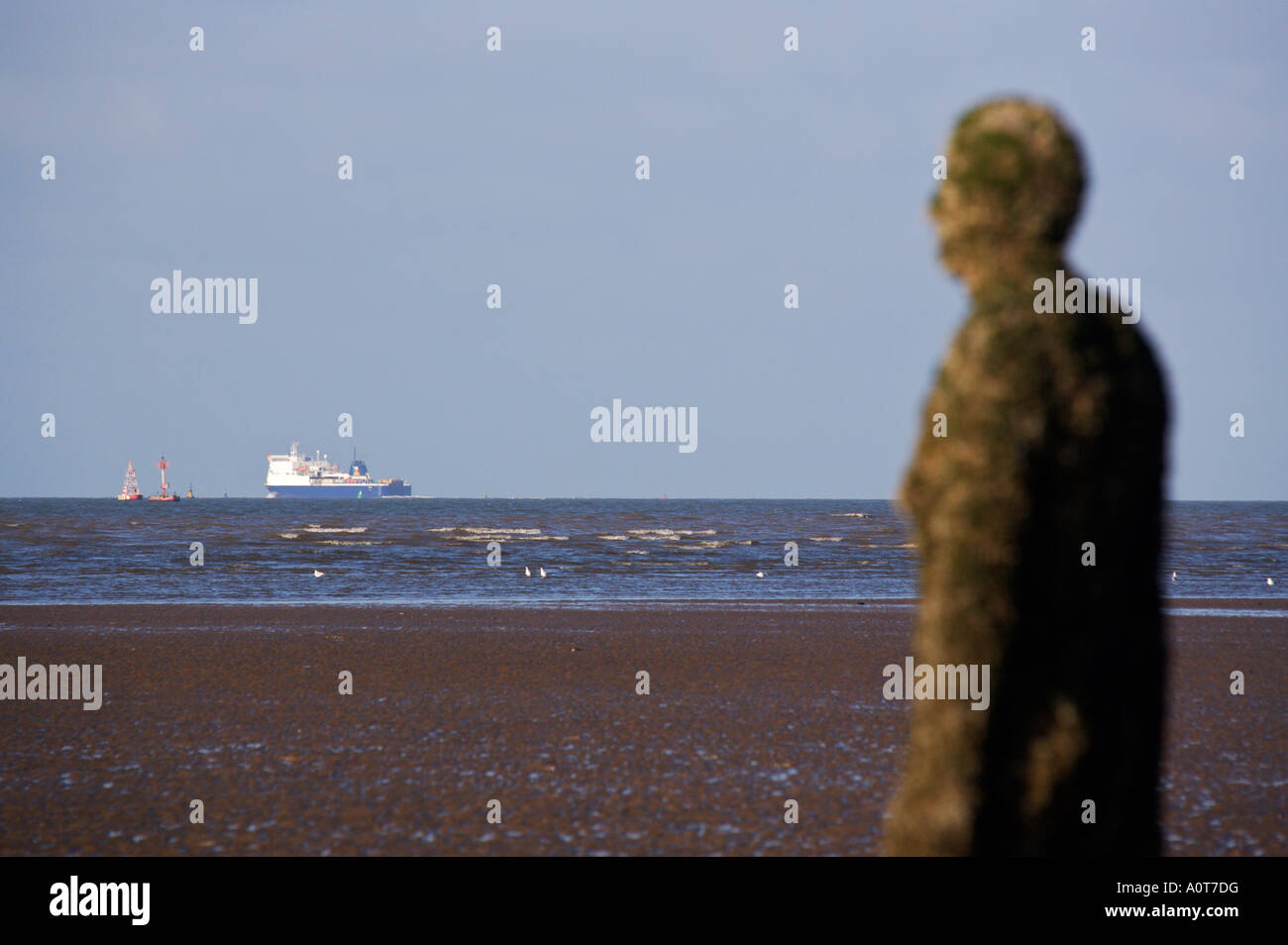 Anthony Gormley's bronze sculptures Crosby beach near Liverpool England