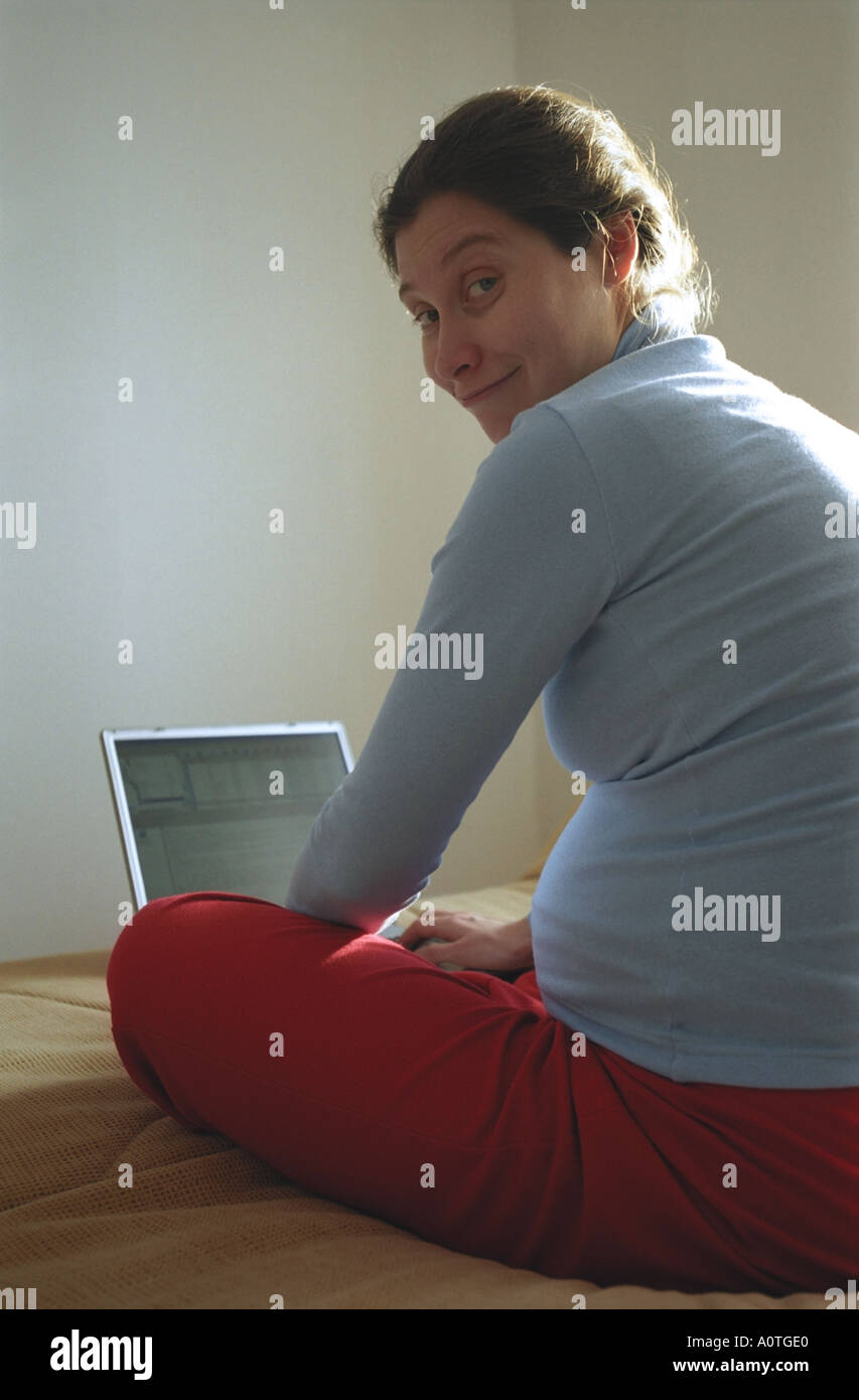 Pregnant woman with laptop Stock Photo Alamy