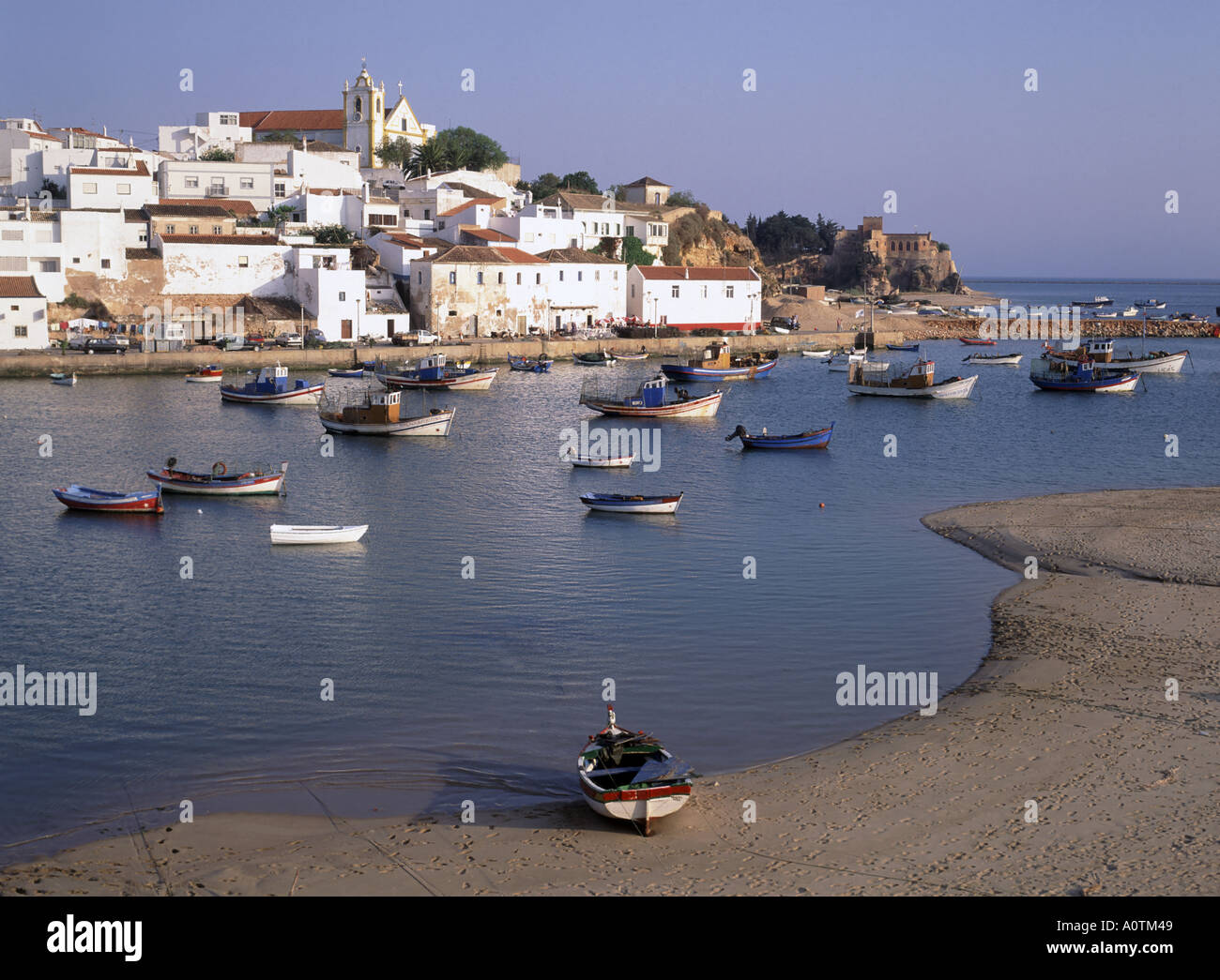Algarve Ferragudo village moored fishing boats in harbour Stock Photo