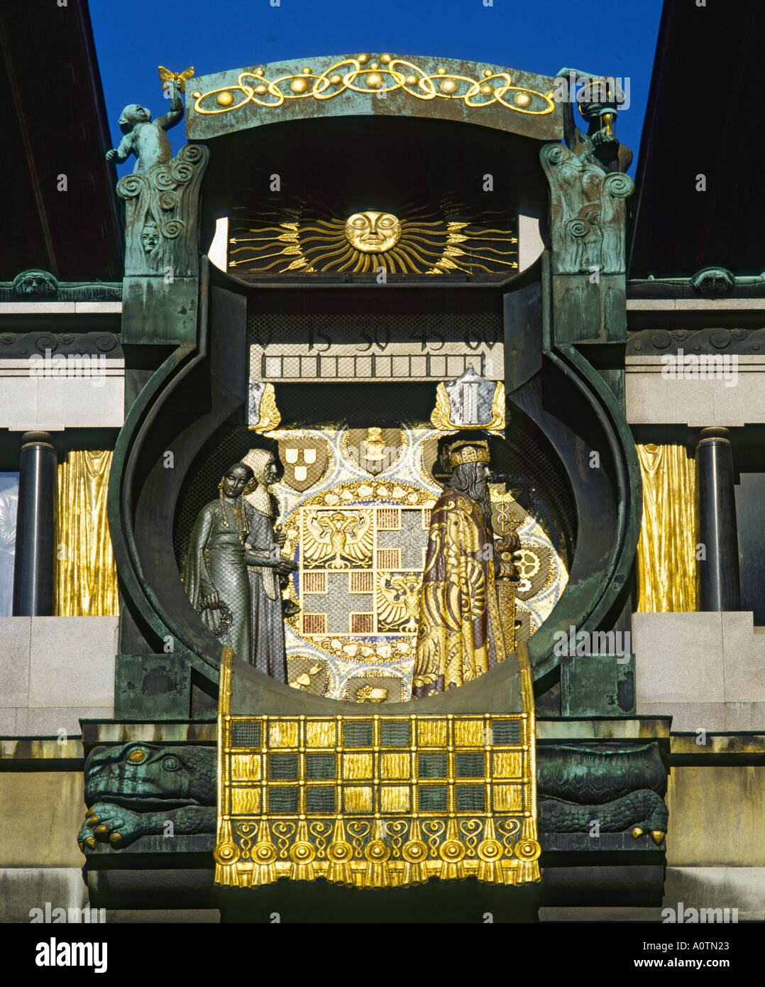 View looking up at the ornately decorated Art Nouveau style shining gold time piece of the Hoher Market clock Vienna Austria Stock Photo