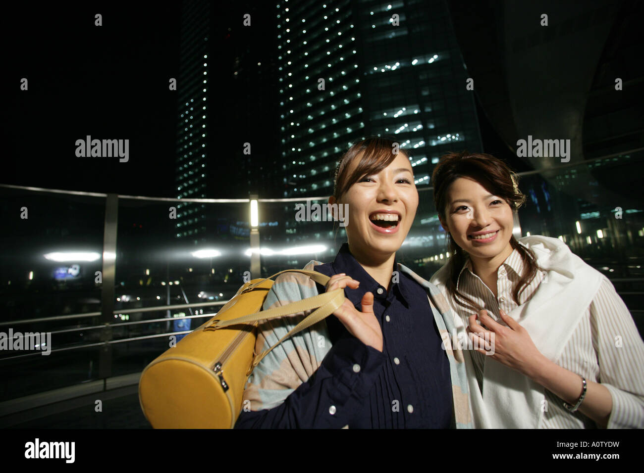 Close up of two young women smiling Stock Photo - Alamy