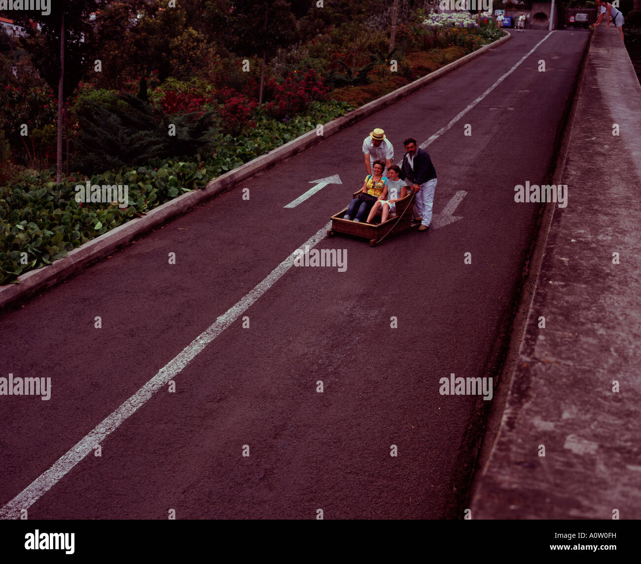 Tourists taking the toboggan ride from Monte to Funchal, Madeira
