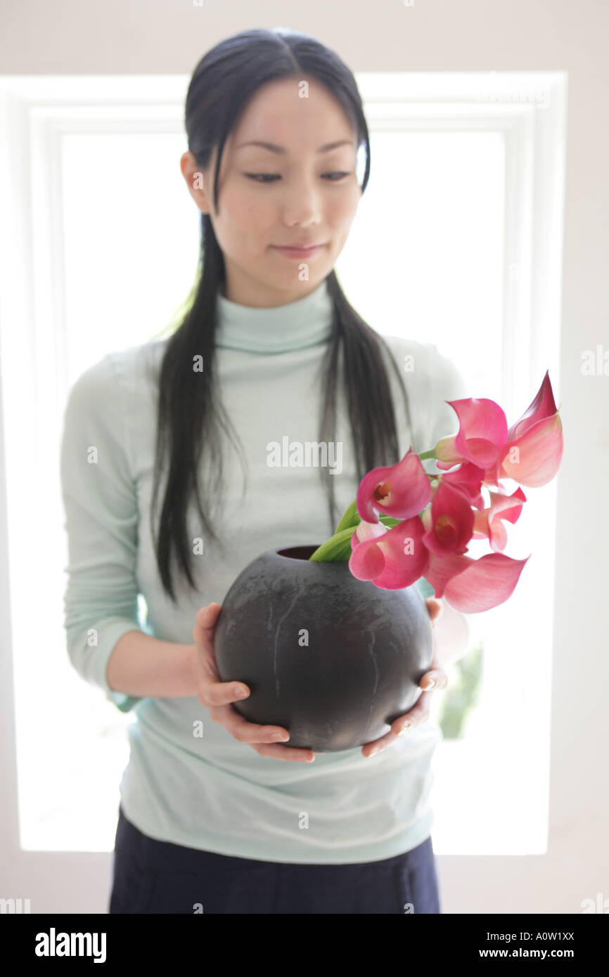Young woman holding flowers in a