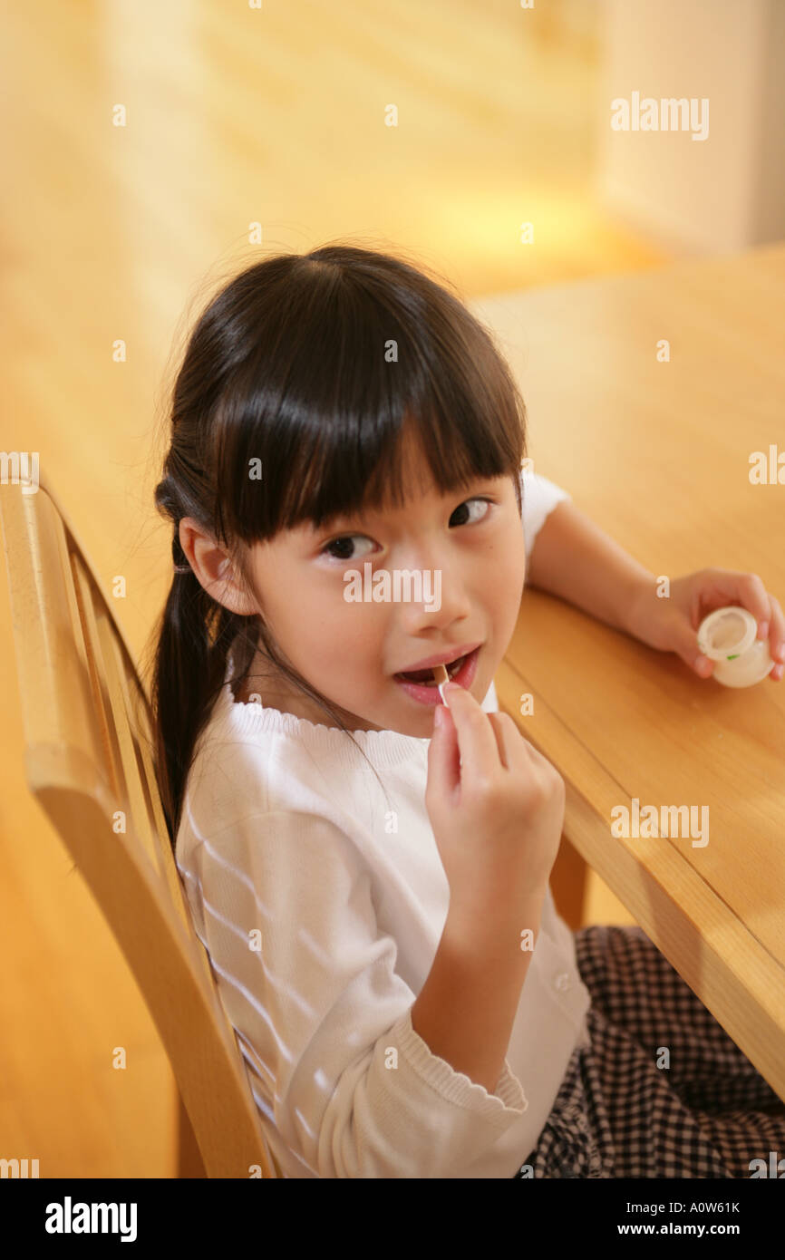 Close up of a girl eating a gelatin dessert Stock Photo Alamy