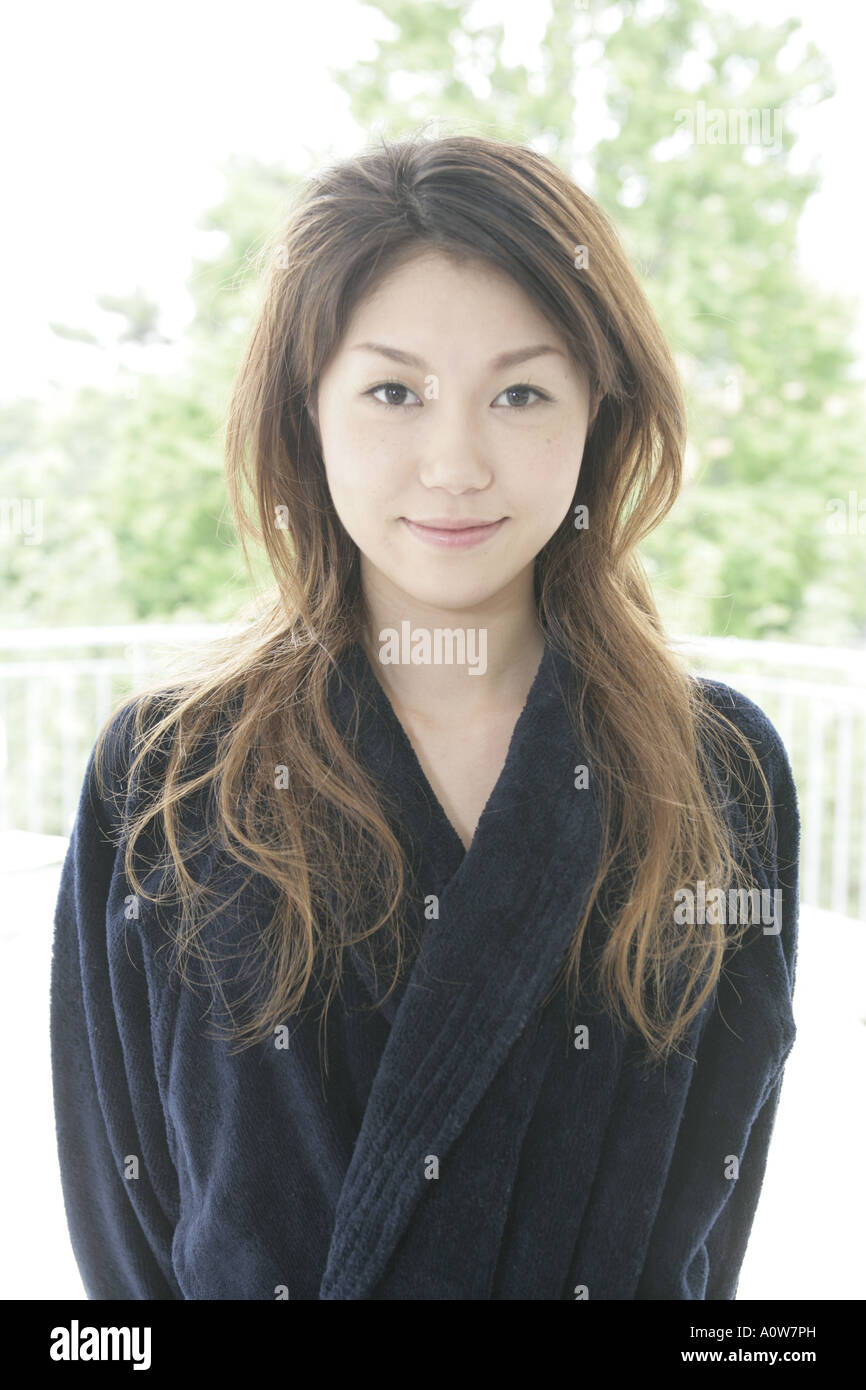 Portrait of a young woman standing Stock Photo - Alamy