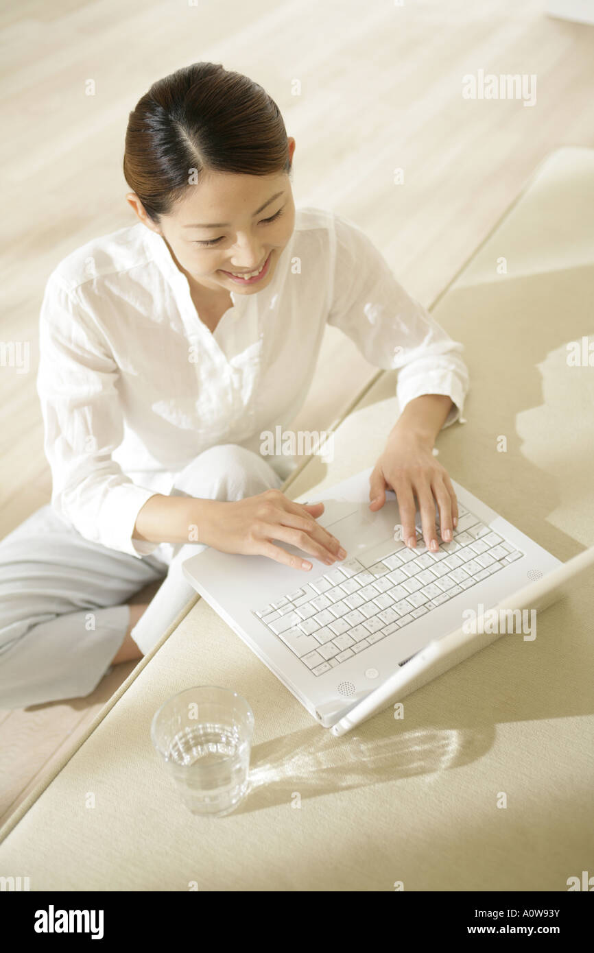 Young woman home sitting table hi-res stock photography and images - Alamy