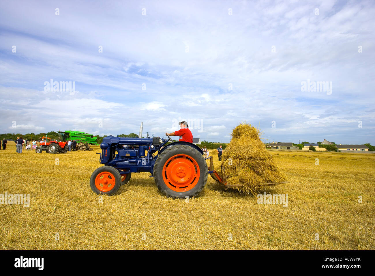 farmer on tractor at harvest time in the fields Stock Photo