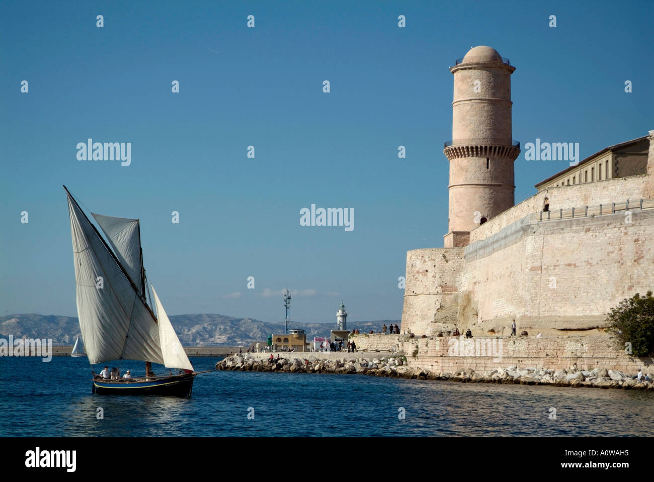 Marseille, France - Fort Saint-Jean and a sailboat with a lateen sail or latin-rig Stock Photo
