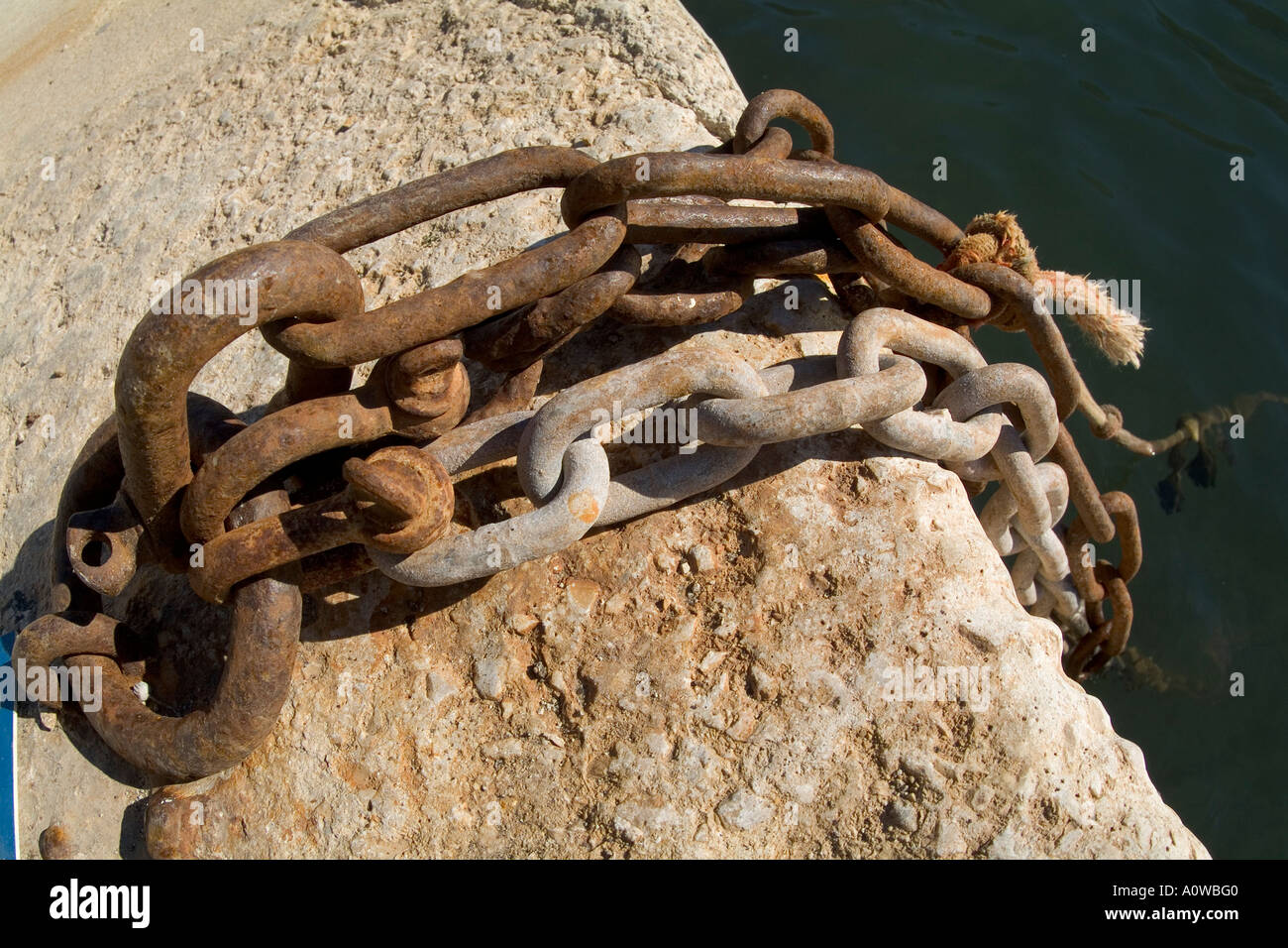 Rusty iron chain on a wharf Stock Photo - Alamy