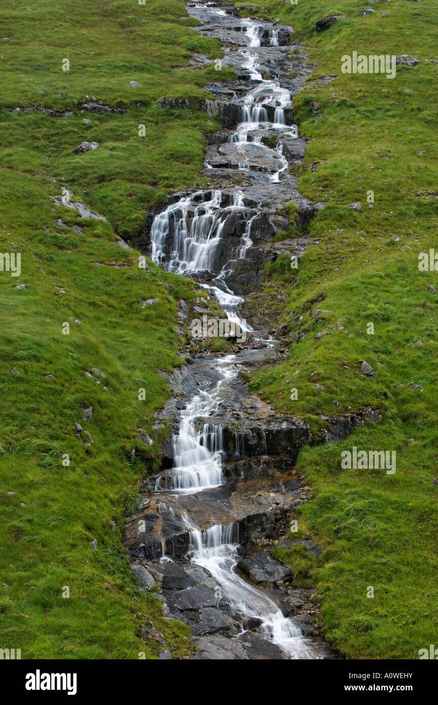 Series of Cascades and Waterfalls in Small Stream Running Down the Side of Buachaille Munro Glen Etive Scotland Stock Photo
