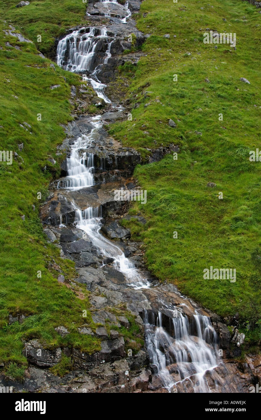 Series of Cascades and Waterfalls in Small Stream Running Down the Side of Beinn Mhic Chasgaig Mountain Glen Etive Scotland Stock Photo