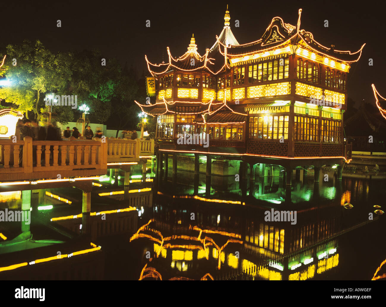 Huxingting or Huxinting Tea House (Heart of Lake Pavilion) and the Nine Zig Zag bridge Old Town Shanghai China by night Stock Photo