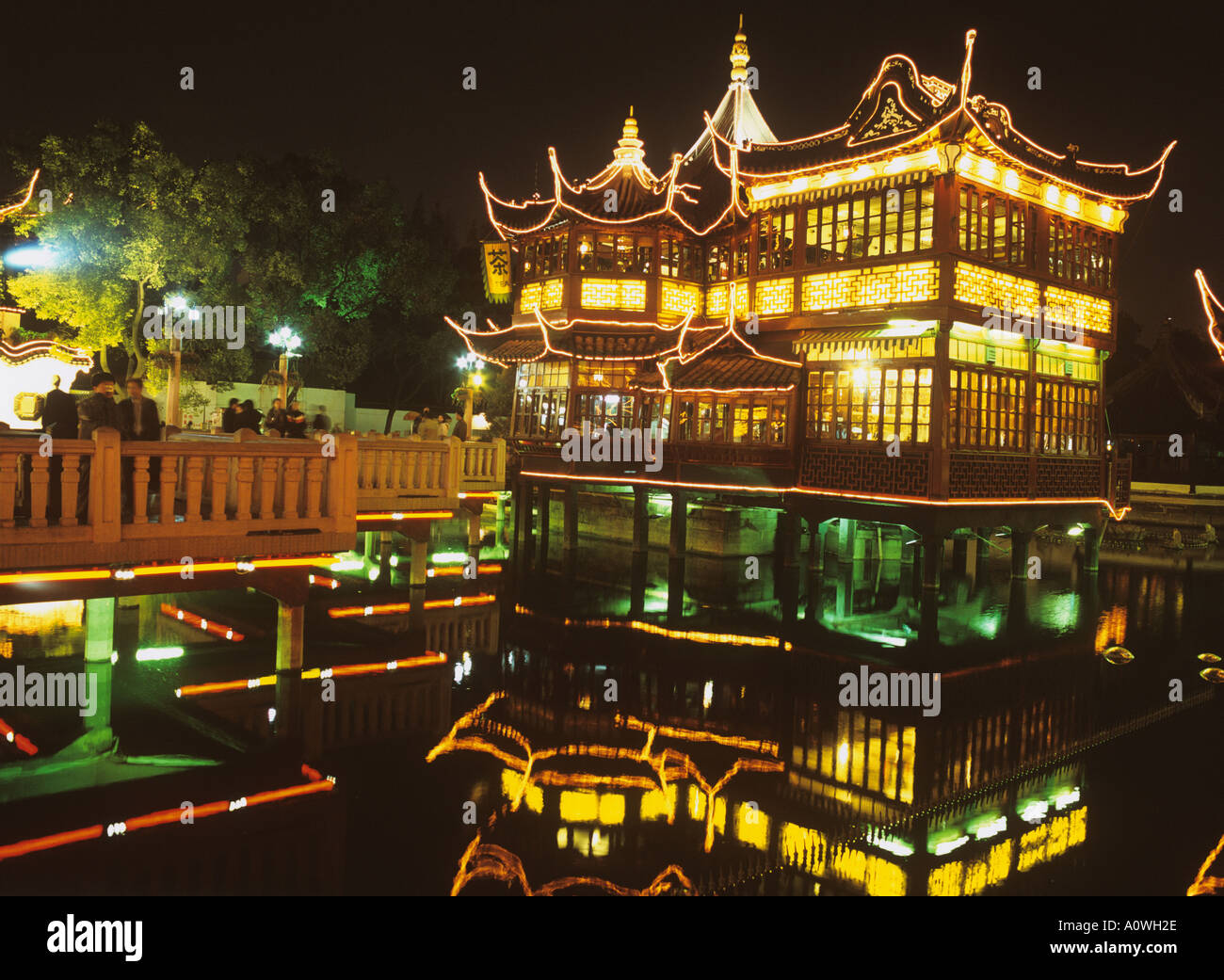 Huxingting or Huxinting Tea House (Heart of Lake Pavilion) and the Nine Zig Zag Bridge Old Town Shanghai China by night Stock Photo