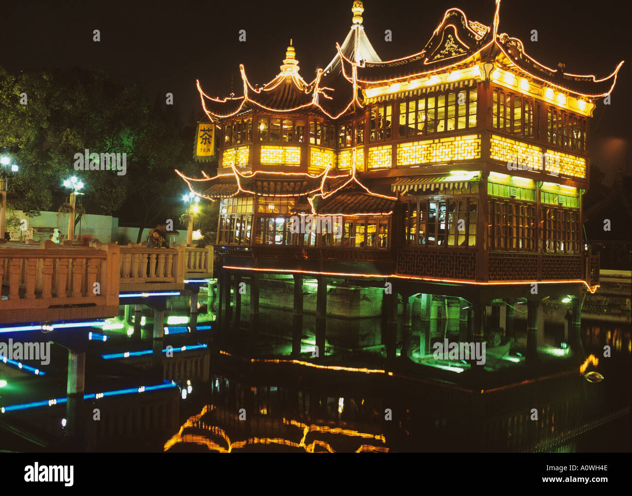 Huxingting  or Huxinting Tea House (Heart of Lake Pavilion)and the Nine Zig Zag Bridge Old Town Shanghai China by night Stock Photo