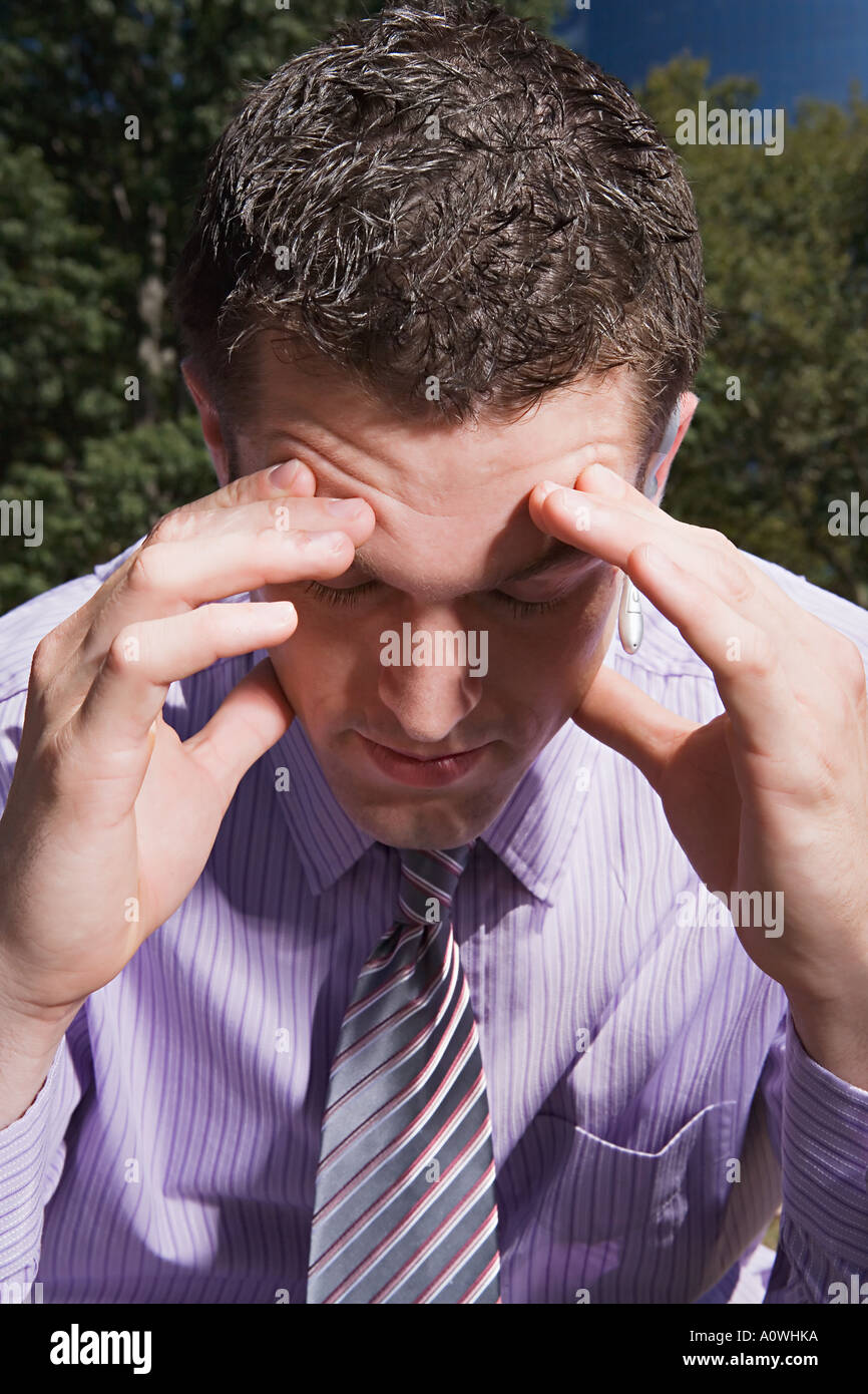 Stressed male office worker Stock Photo