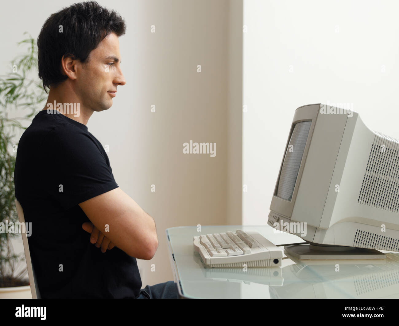 Man looking at computer screen Stock Photo
