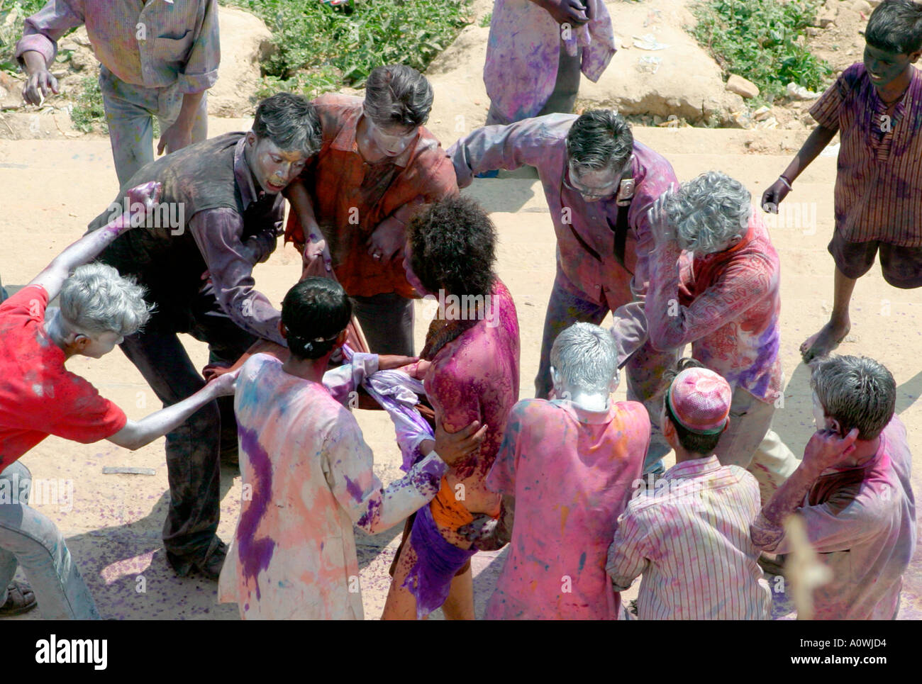 a tourist gets attacked at holi festival in varanasi Stock Photo