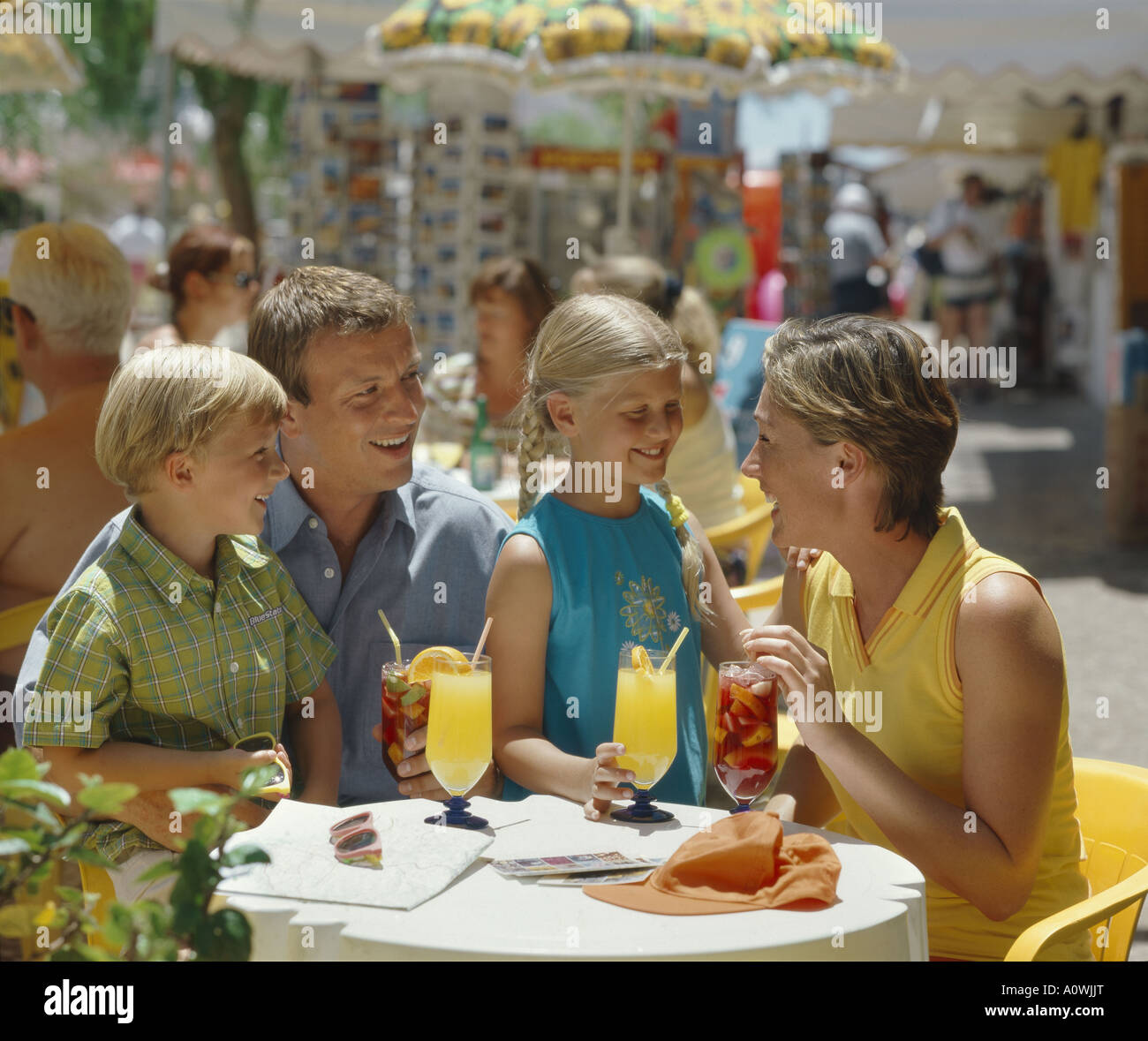 Family drinking on holiday at a street café in Portugal Stock Photo