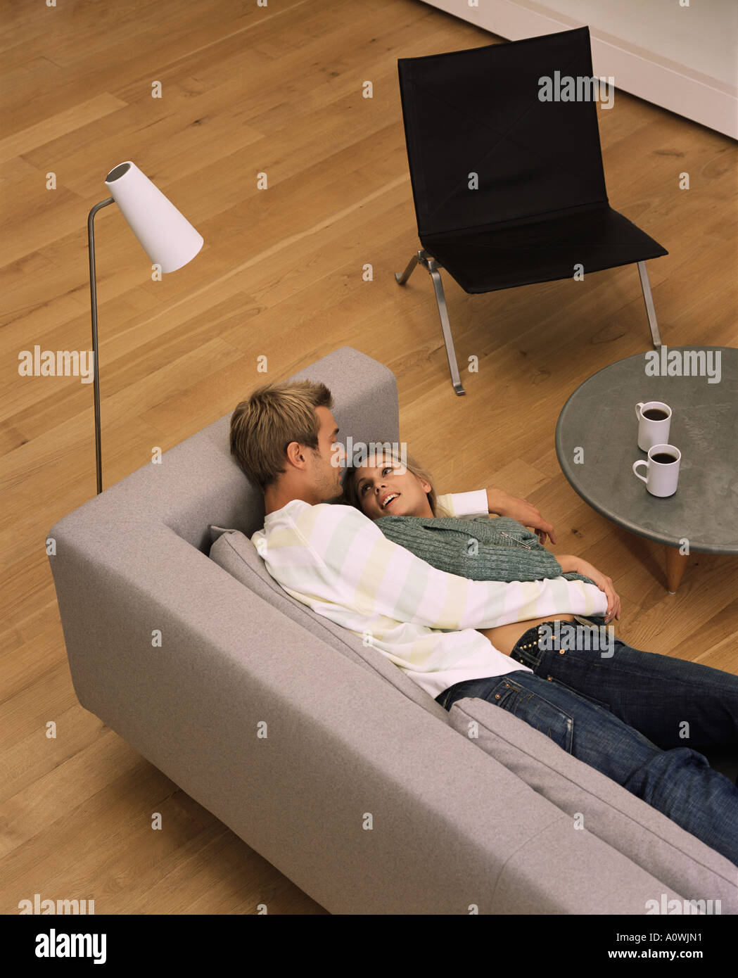 Couple lying on the sofa Stock Photo