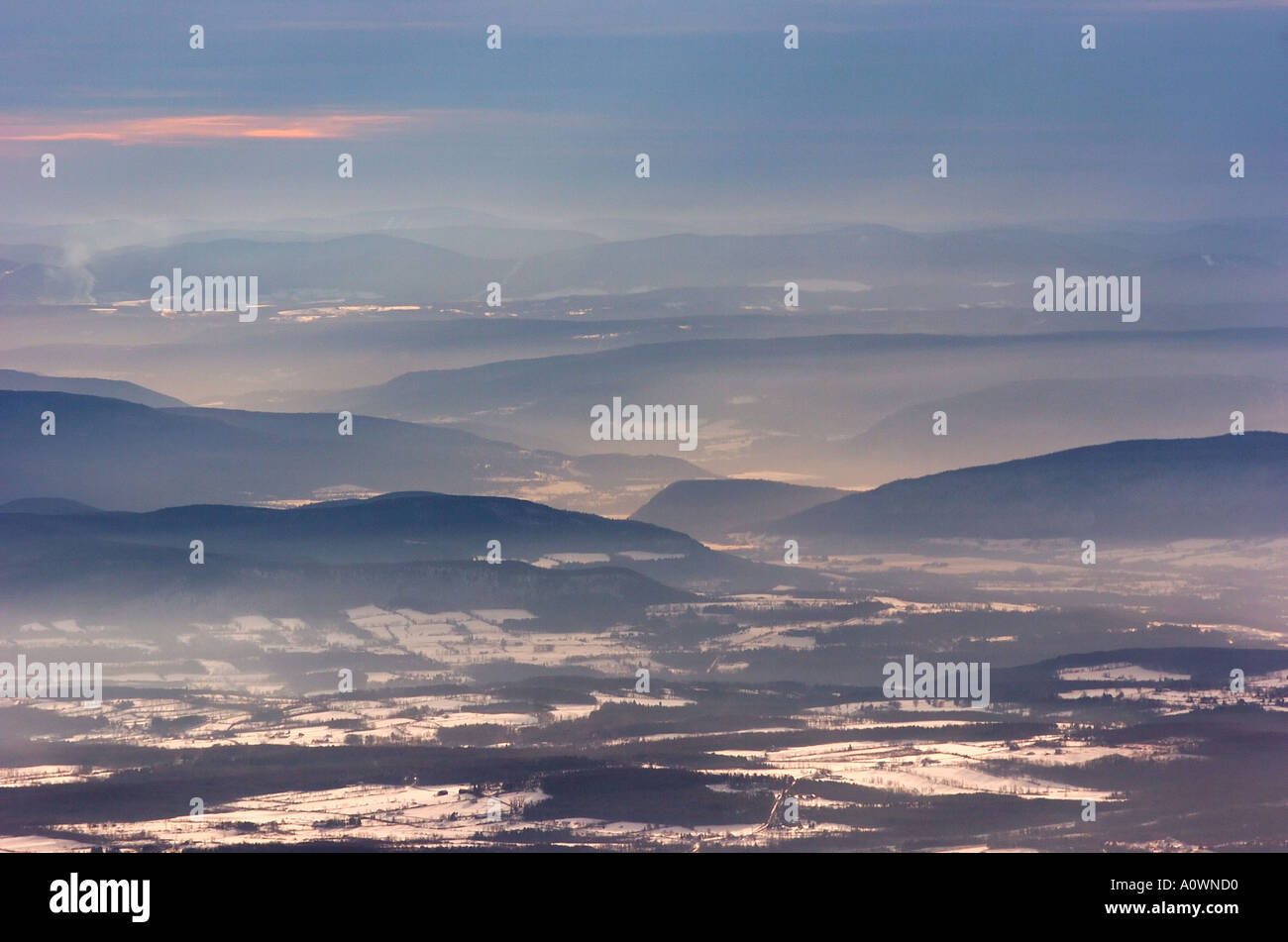 Snowy landscape with distant mountains Stock Photo